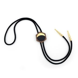 New in package bolo tie from designer Minima Maxima, sold walnut wood. Unisex.